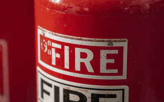 Image showing why plastic seals matter on fire extinguishers.